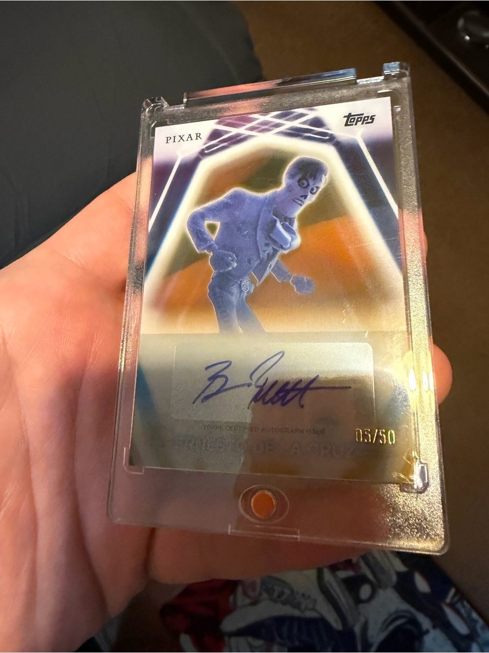 Topps Pixar Ernesto De La Cruz Neon Autograph Card - Silver & Orange Holo